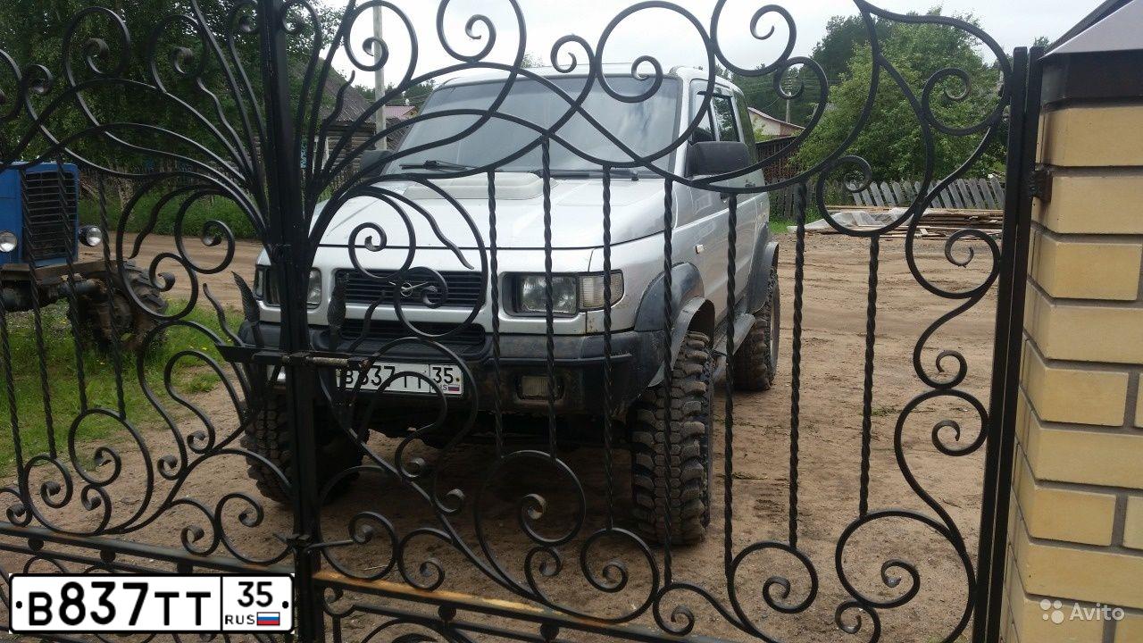 Фото автомобиля UAZ 3162, 2005 — госномер Е261КМ147. Цвет: ОРАНЖЕВЫЙ