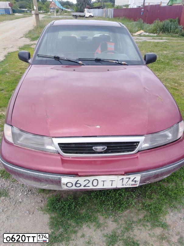 Фото автомобиля DAEWOO NEXIA, 2006 — госномер О620ТТ174. Цвет: ИСПАНСКИЙ КРАСНЫЙ
