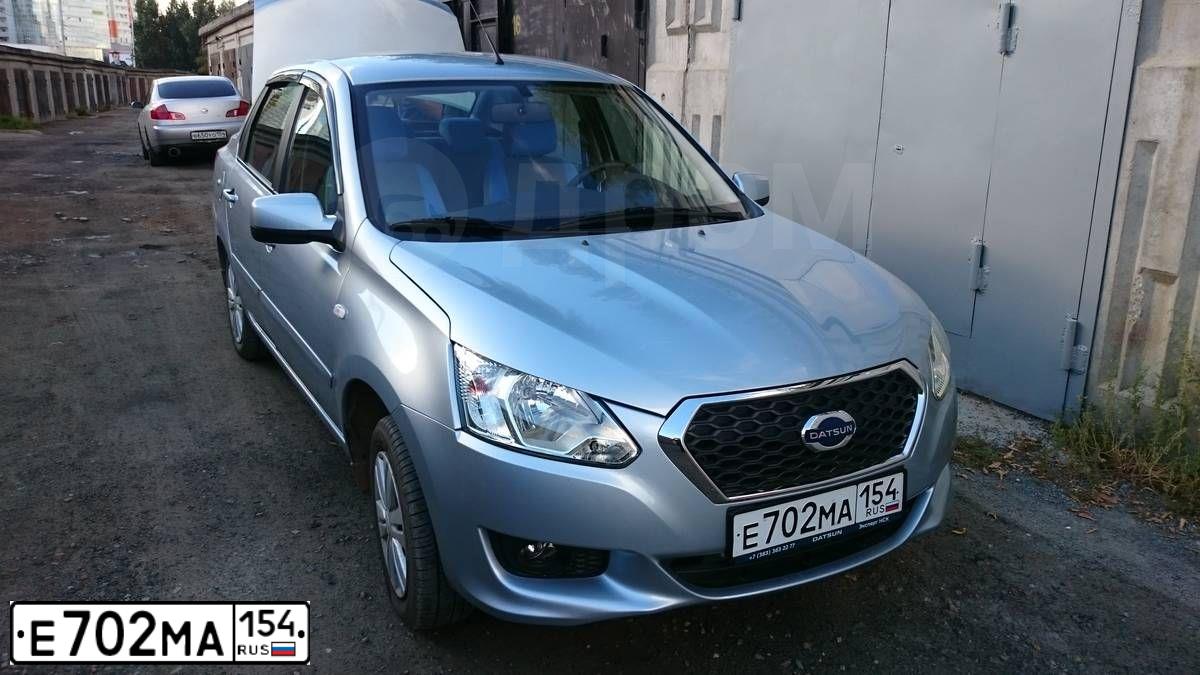 Фото автомобиля DATSUN ON-DO, 2015 — госномер Е702МА154. Цвет: СВЕТЛО ГОЛУБОЙ