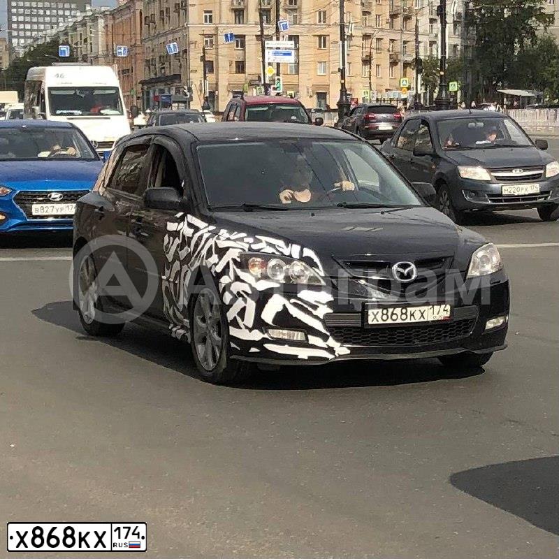 Фото автомобиля MAZDA 3, 2007 — госномер Р724ВУ74. Цвет: ЧЕРНЫЙ