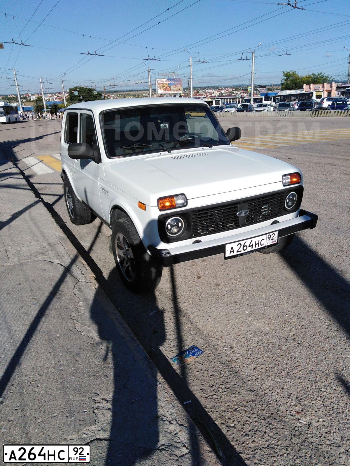 Фото автомобиля ВАЗ 21214, 2009 — госномер А264НС92. Цвет: БЕЛЫЙ