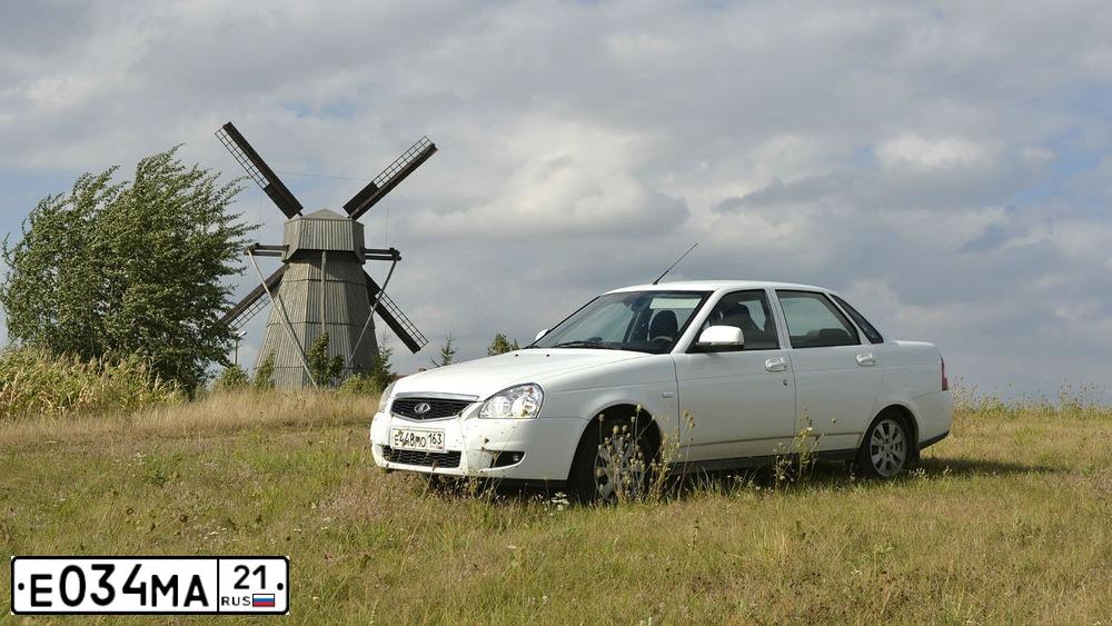 Фото автомобиля LADA 2172 PRIORA, 2009 — госномер Е034МА21. Цвет: ЧЕРНЫЙ