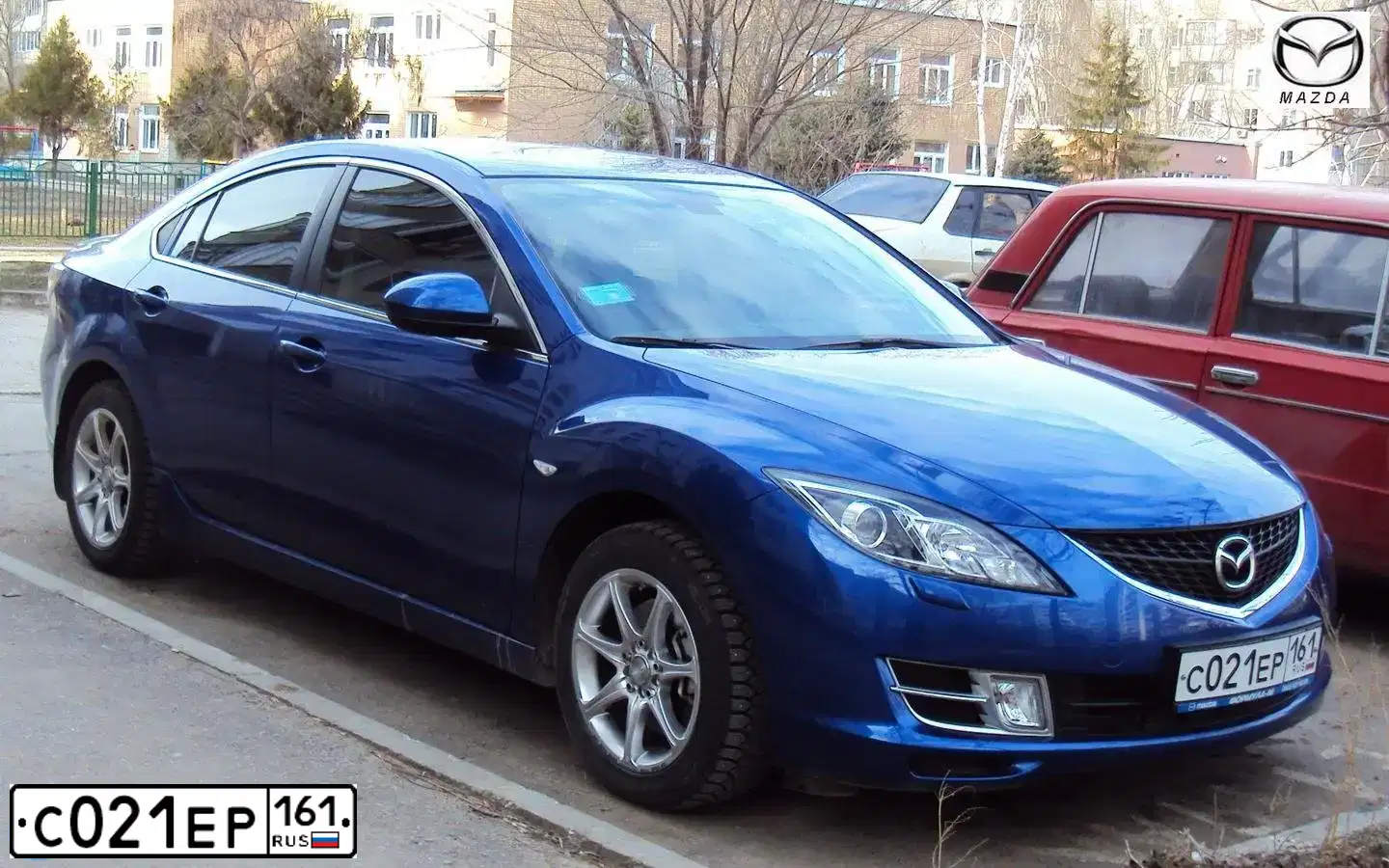 Фото автомобиля KIA SPORTAGE, 2011 — госномер С021ЕР161. Цвет: ОРАНЖЕВЫЙ