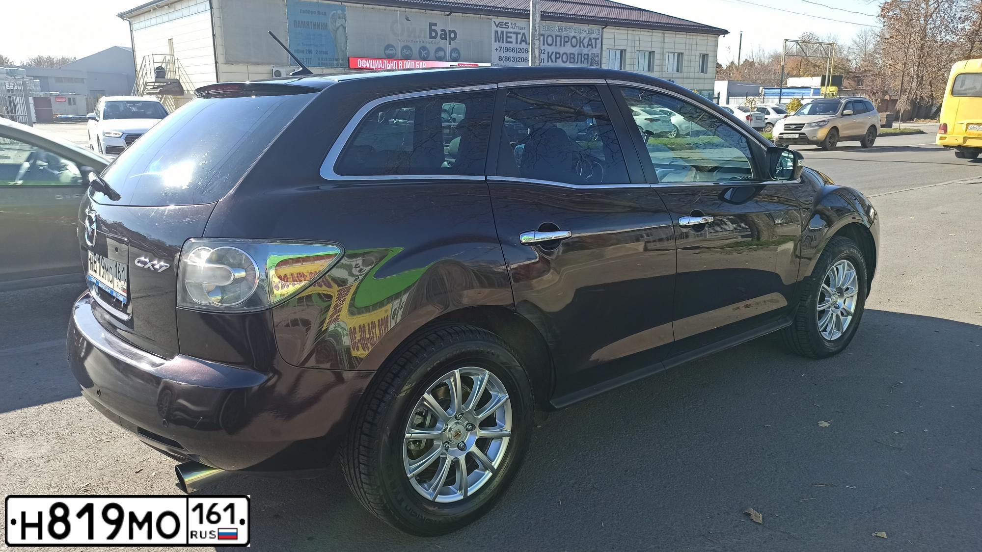 Фото автомобиля MAZDA CX-7, 2008 — госномер Н819МО161. Цвет: ТЕМНО-ВИШНЕВЫЙ