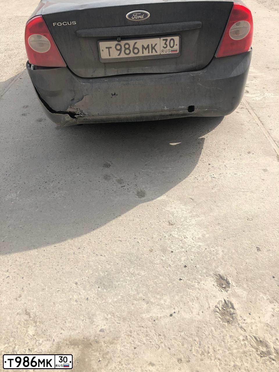 Фото автомобиля FORD FOCUS, 2010 — госномер Т986МК30. Цвет: ЧЕРНЫЙ