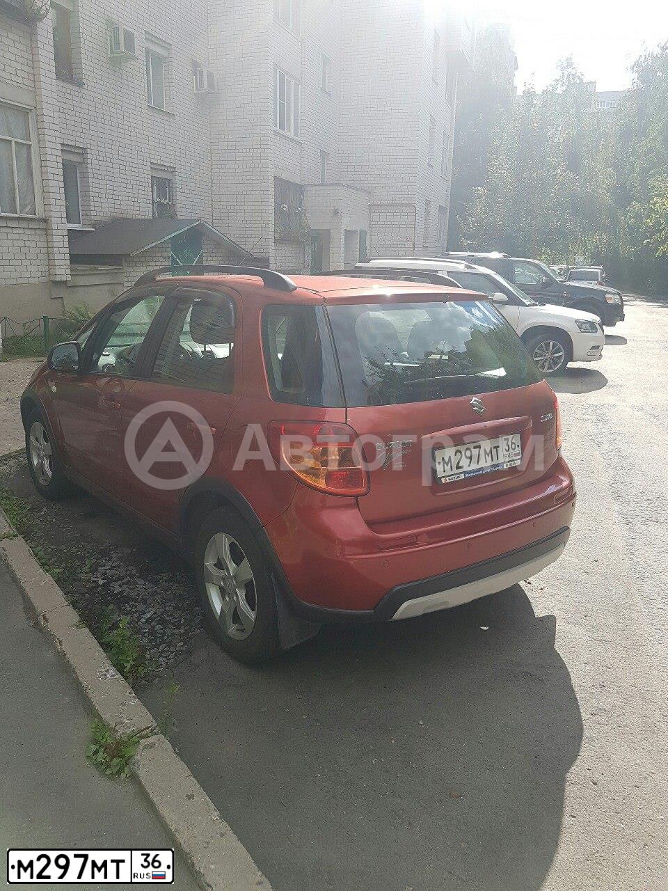 Фото автомобиля SUZUKI SX 4, 2011 — госномер М297МТ36. Цвет: ОРАНЖЕВЫЙ