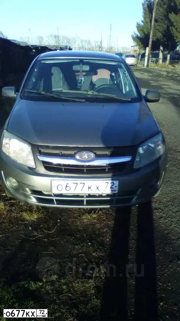 Фото автомобиля LADA 2190 GRANTA, 2012 — госномер О677КХ72. Цвет: Темно-серый металлик