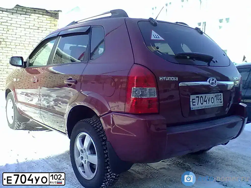 Фото автомобиля HYUNDAI TUCSON, 2008 — госномер Н494ТТ159. Цвет: ТЕМНО-КРАСНЫЙ