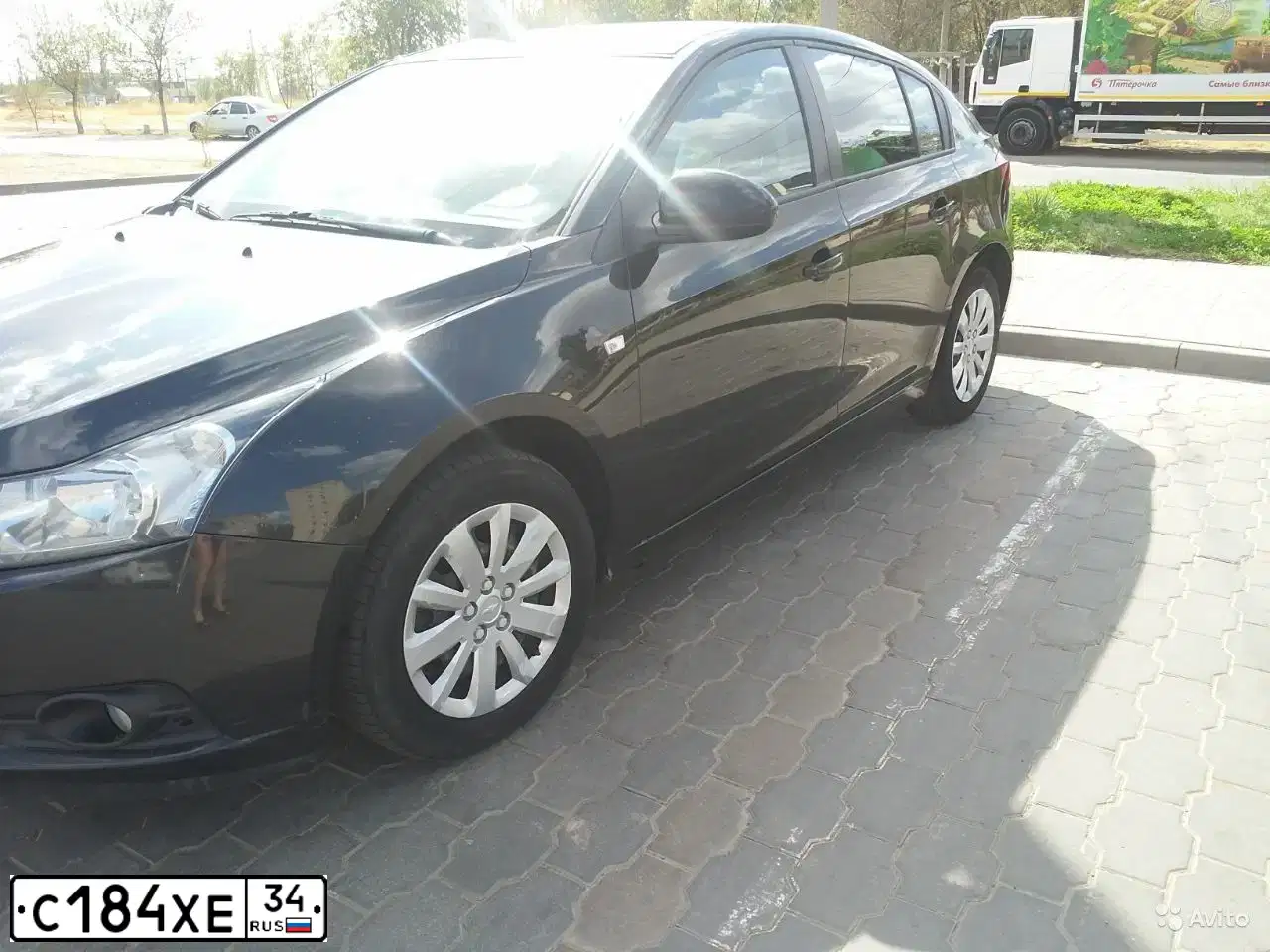 Фото автомобиля CHEVROLET CRUZE, 2012 — госномер С184ХЕ34. Цвет: ЧЕРНЫЙ МЕТАЛЛИК