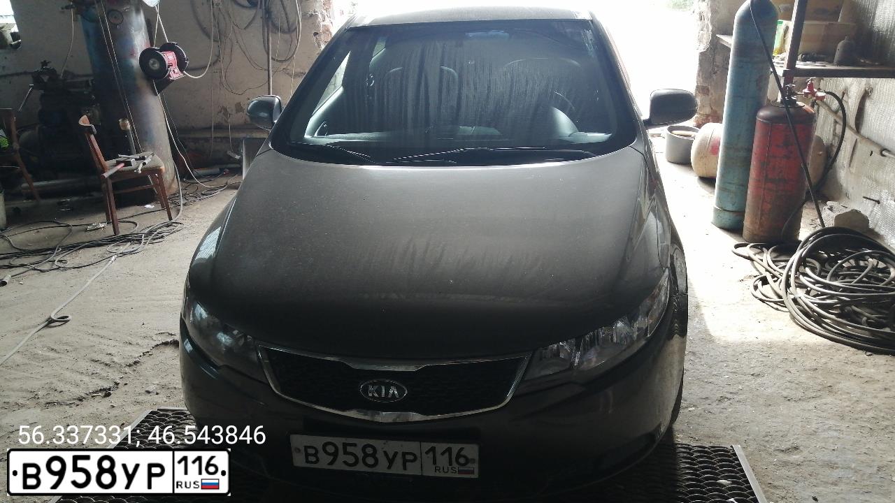 Фото автомобиля KIA CERATO, 2010 — госномер М828ЕС21. Цвет: бронзовый