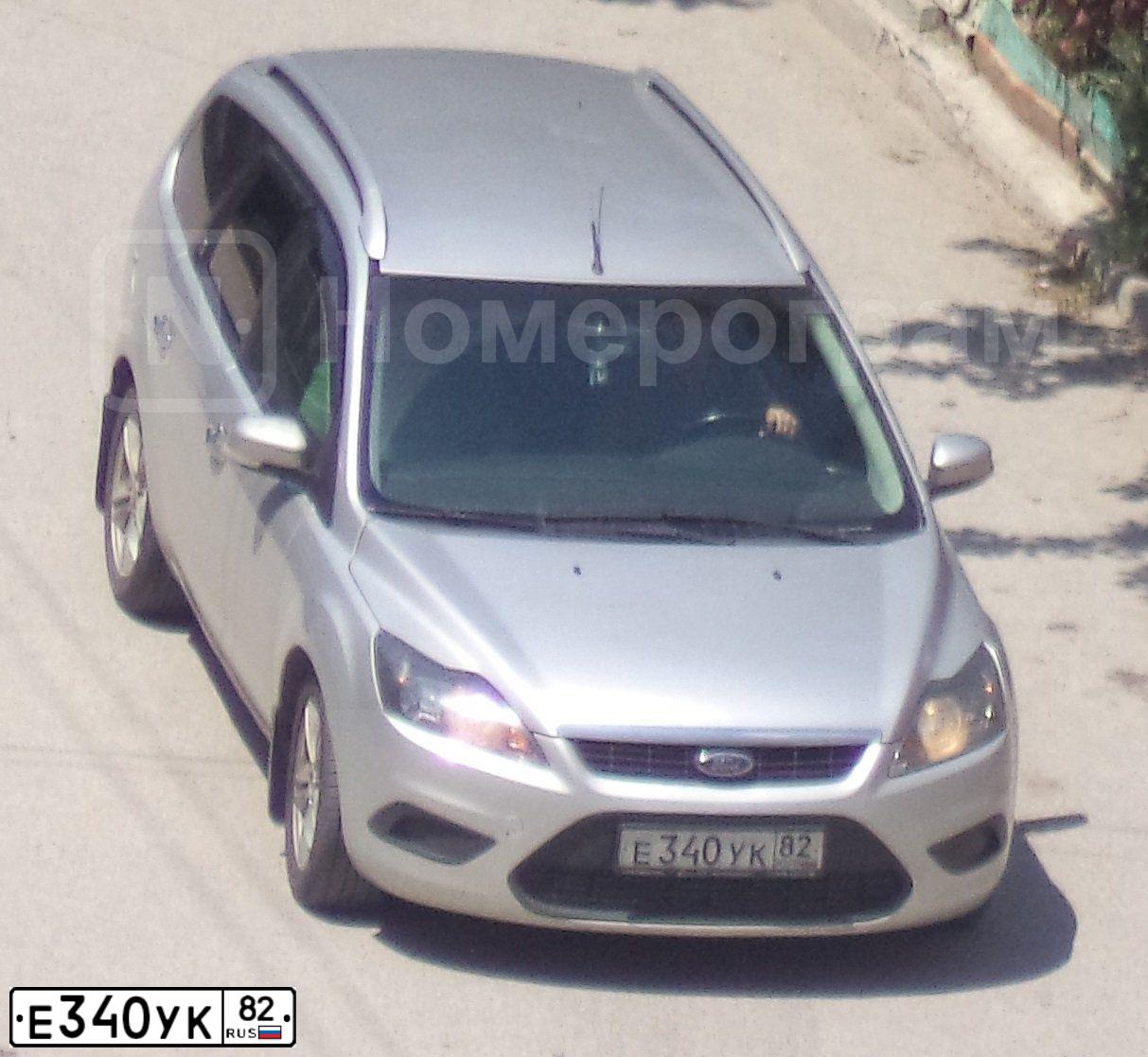 Фото автомобиля FORD FOCUS, 2008 — госномер Е340УК82. Цвет: СВЕТЛО-СЕРЫЙ