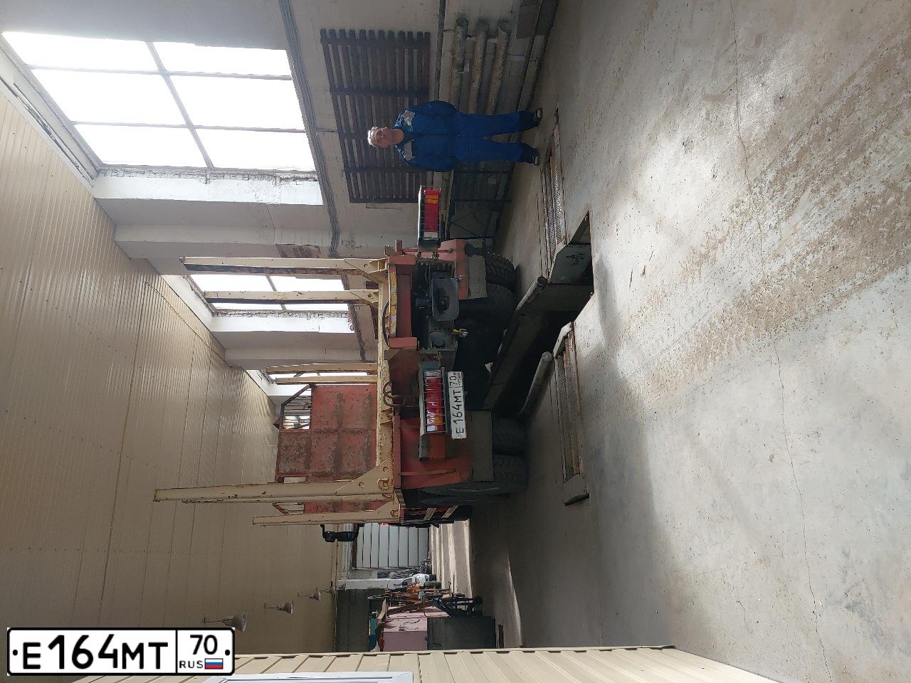 Фото автомобиля IVECO AMT URAL IVECO 6339 /6X6/, 2012 — госномер Е164МТ70. Цвет: Красный