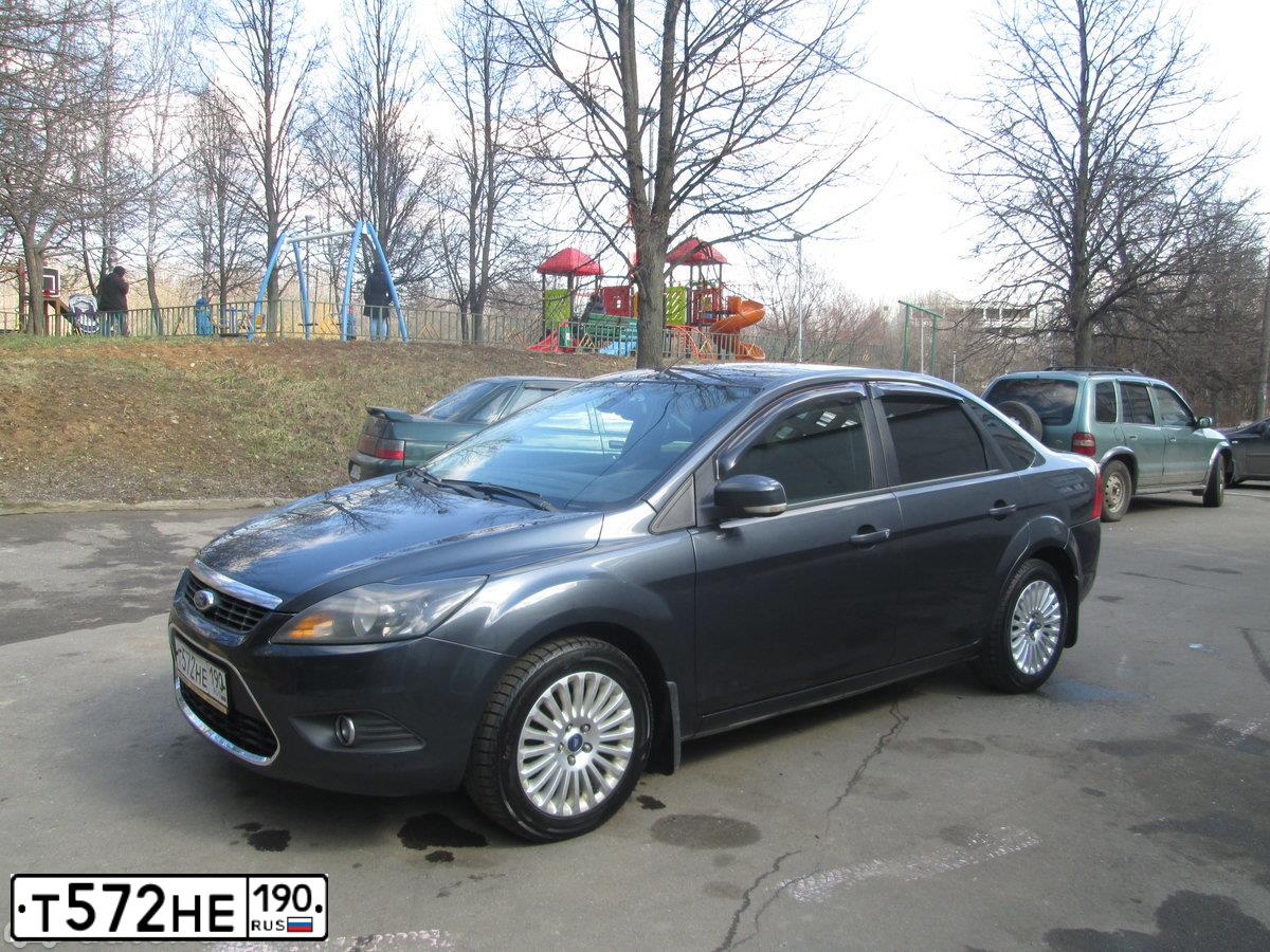 Фото автомобиля FORD FOCUS, 2008 — госномер Т951НН199. Цвет: Серый