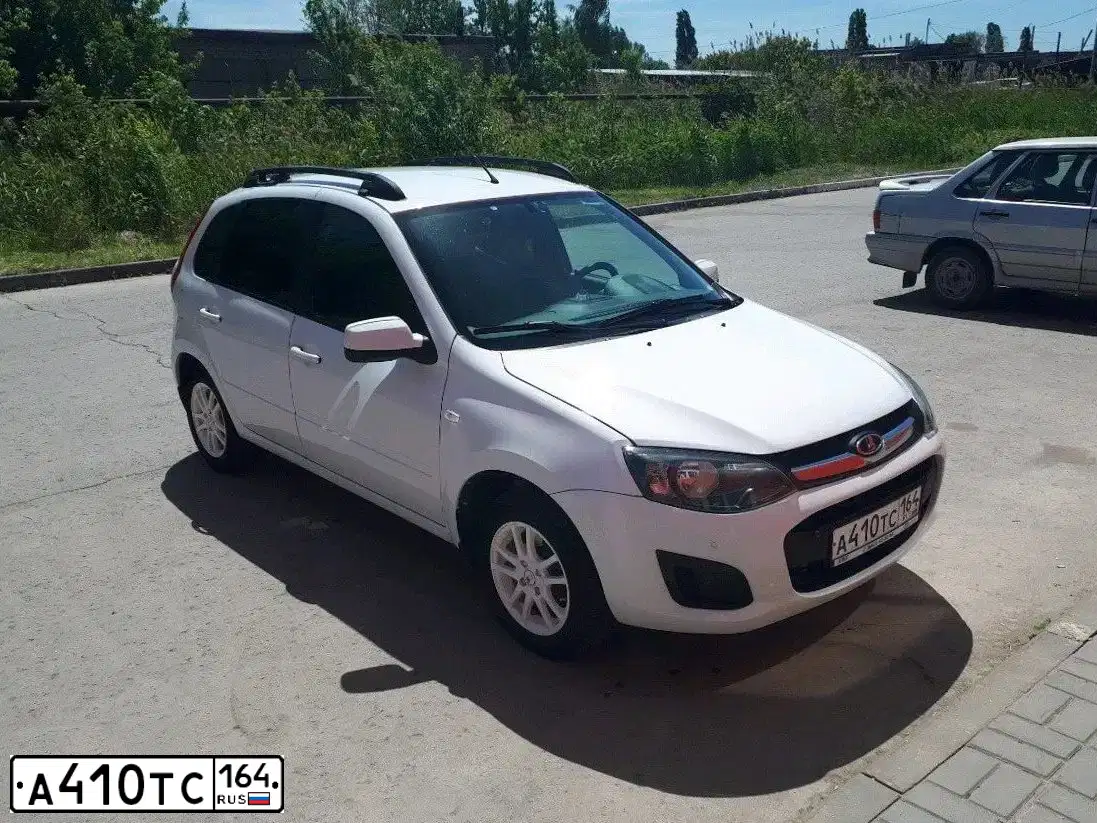 Фото автомобиля LADA 2192 KALINA, 2014 — госномер А410ТС164. Цвет: Белый