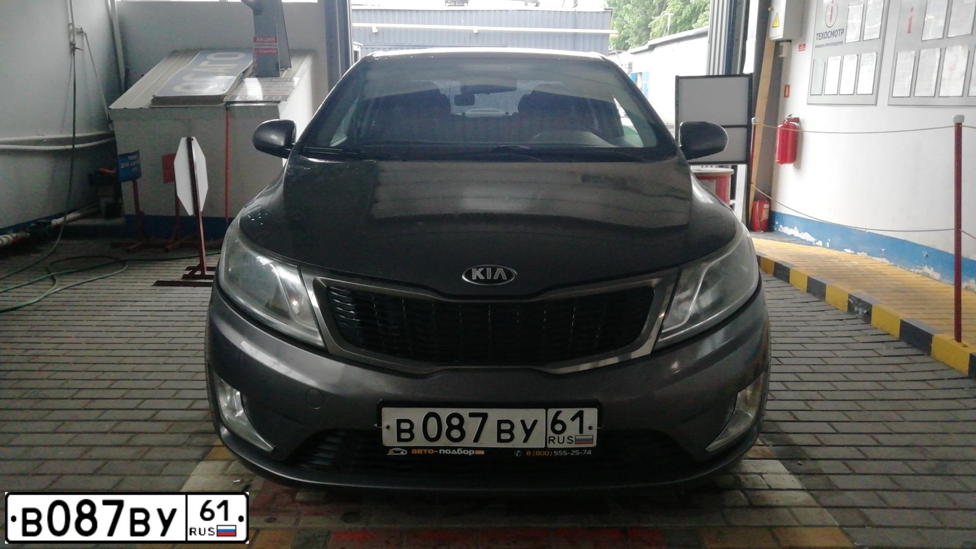 Фото автомобиля KIA RIO, 2014 — госномер В087ВУ61. Цвет: ТЕМНО-СЕРЫЙ
