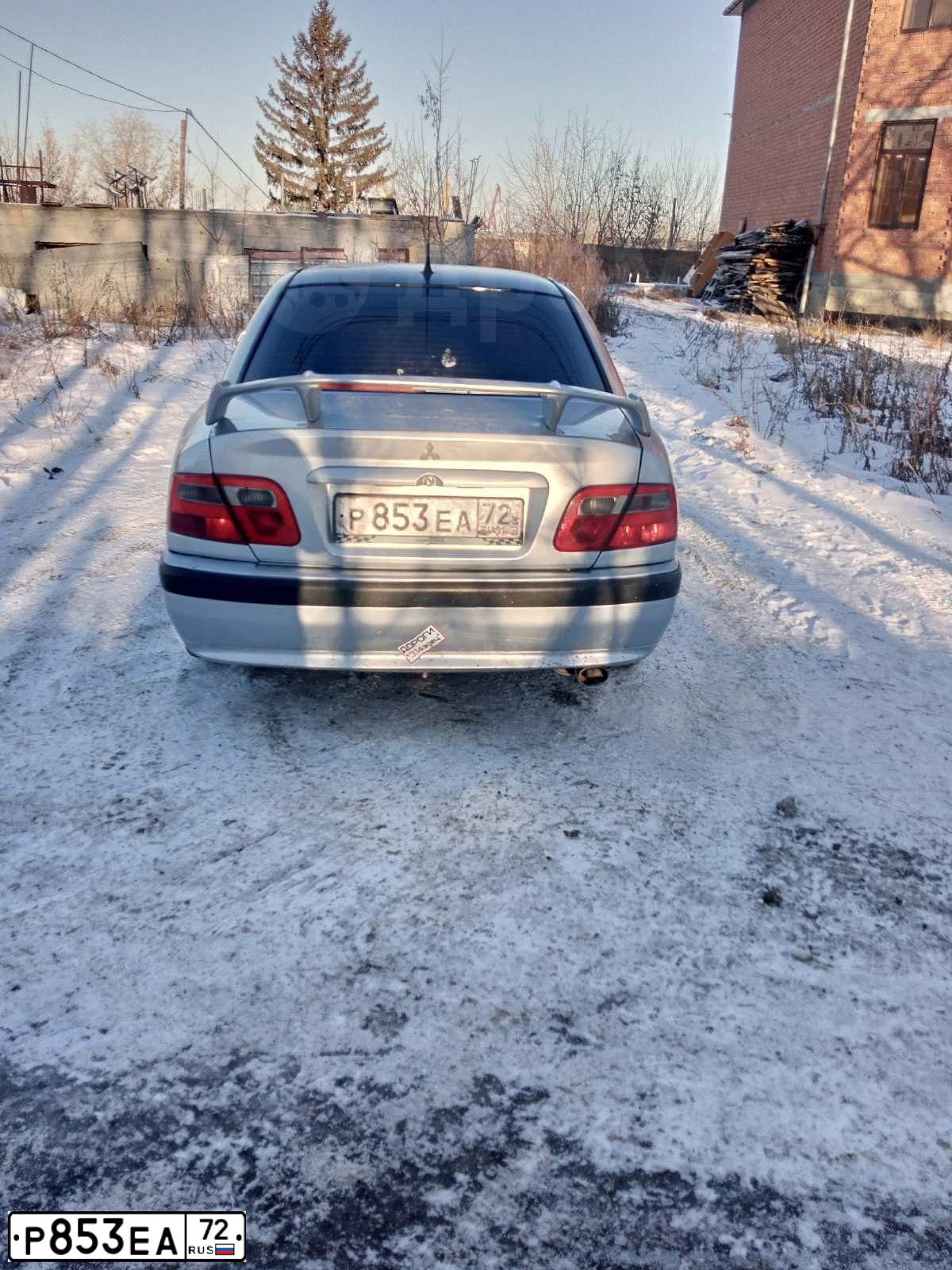 Фото автомобиля MITSUBISHI CARISMA, 2001 — госномер А408ХК72. Цвет: СЕРЕБРИСТЫЙ