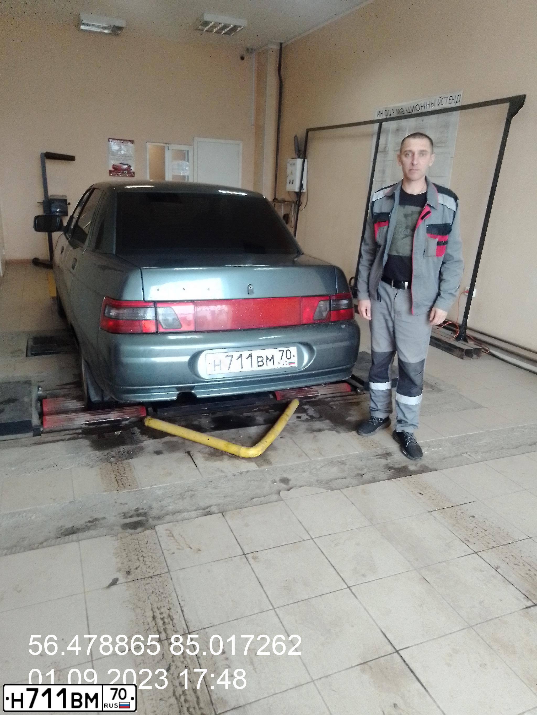 Фото автомобиля LADA 2110 LADA, 2006 — госномер Н711ВМ70. Цвет: Серо-сине-зеленый