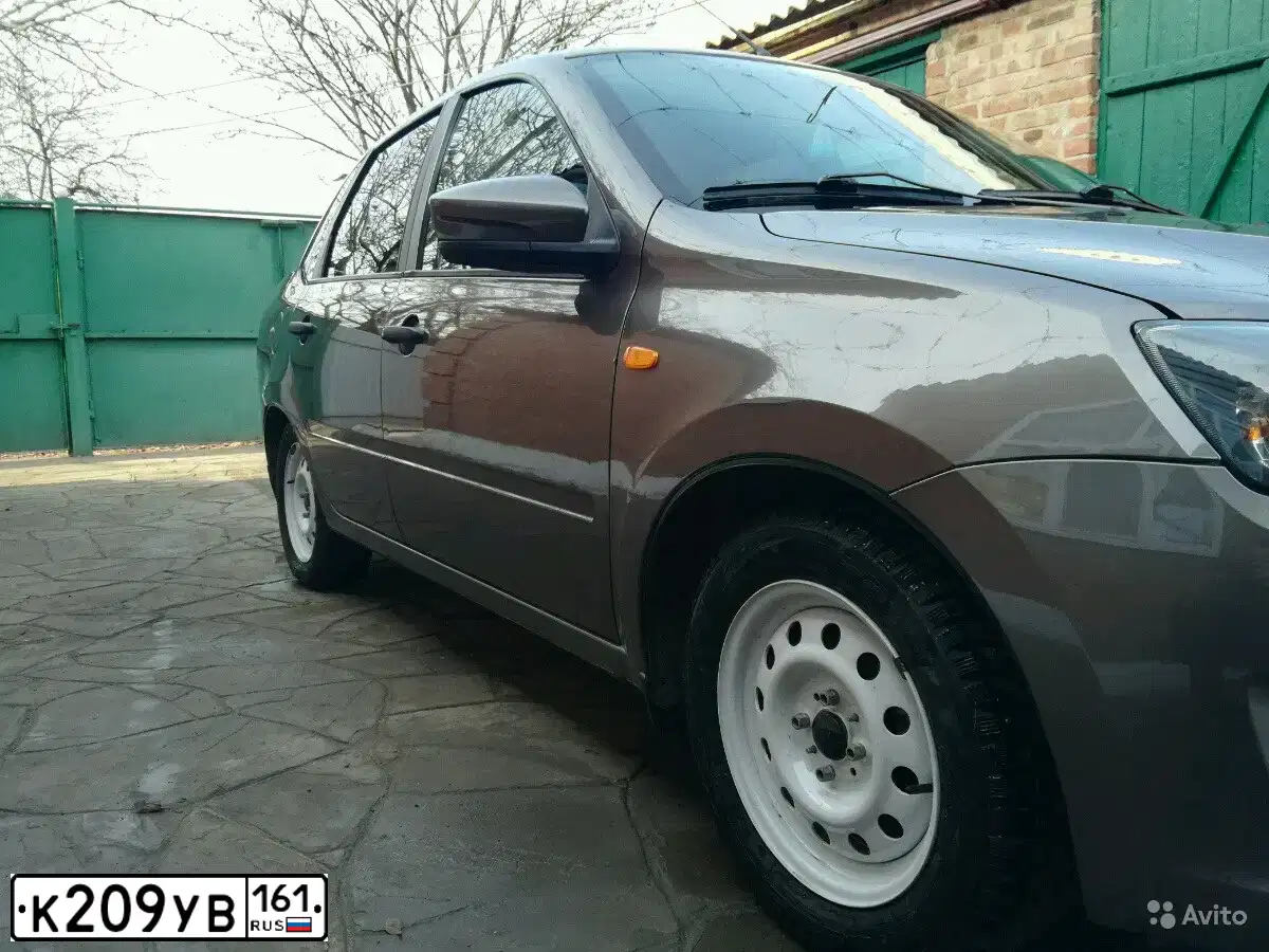 Фото автомобиля LADA GRANTA, 2015 — госномер Т382СТ05. Цвет: Золотисто-коричневый