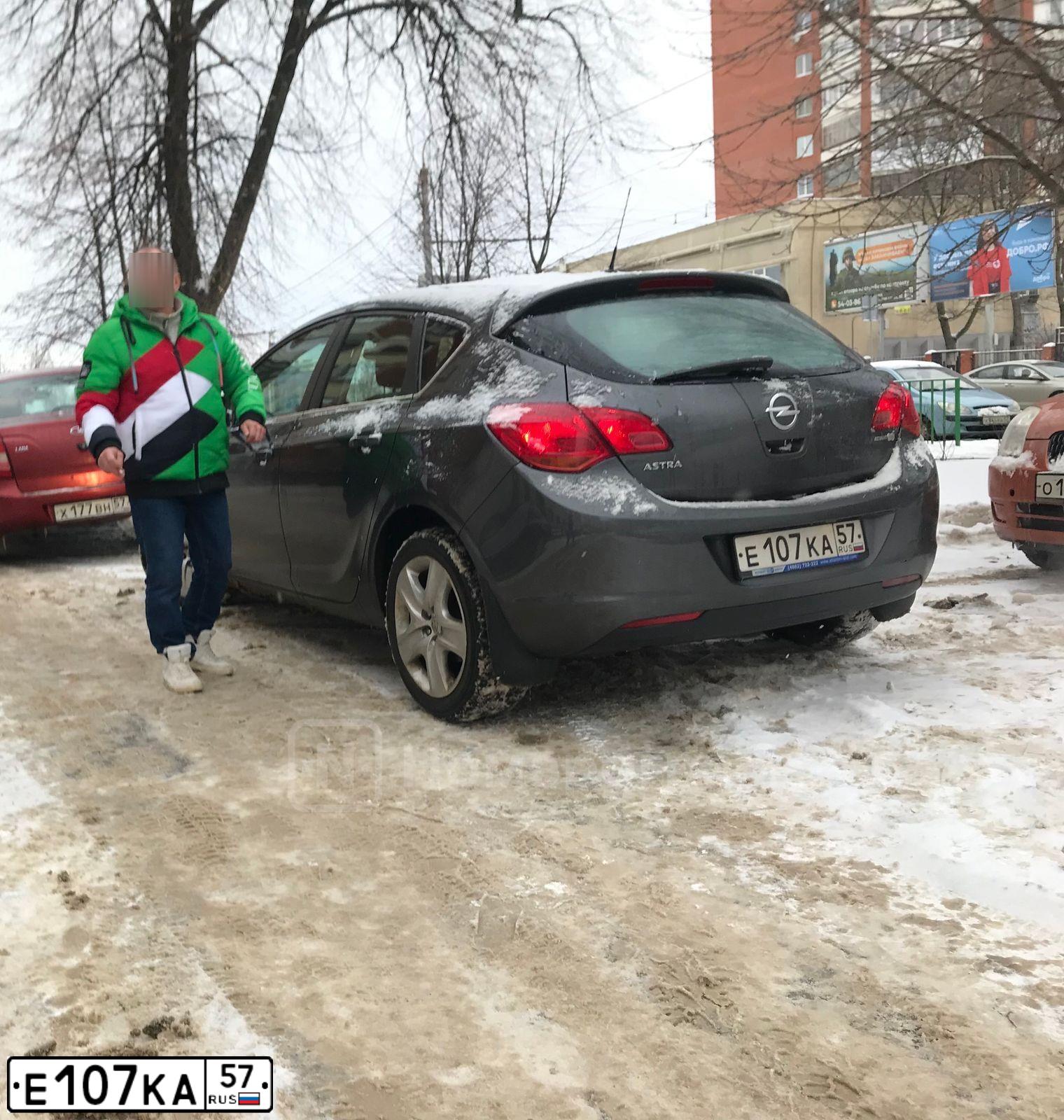 Фото автомобиля OPEL ASTRA, 2011 — госномер Е107КА57. Цвет: СЕРЫЙ МЕТАЛЛИК