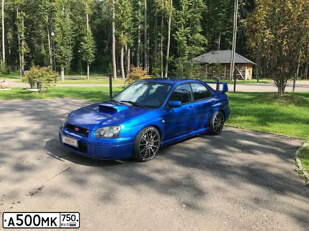 Фото автомобиля SUBARU IMPREZA, 2005 — госномер Т011УА97. Цвет: Серый