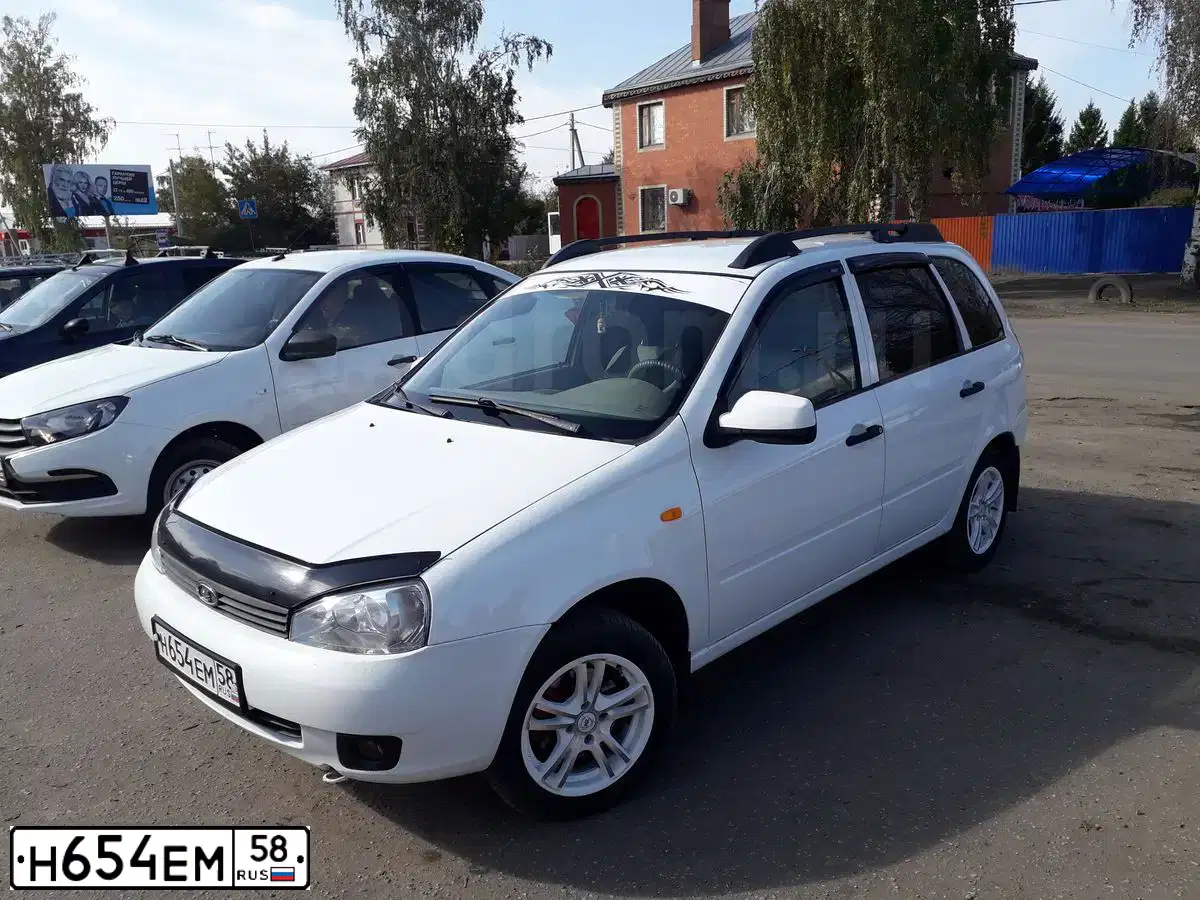 Фото автомобиля LADA 1117 KALINA, 2010 — госномер Н654ЕМ58. Цвет: Белый