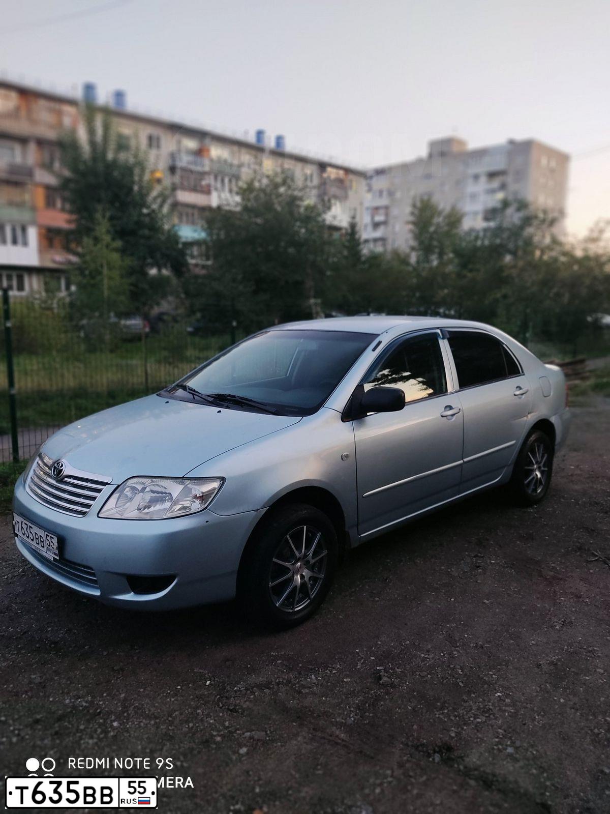 Фото автомобиля TOYOTA COROLLA, 2004 — госномер Т635ВВ55. Цвет: голубой