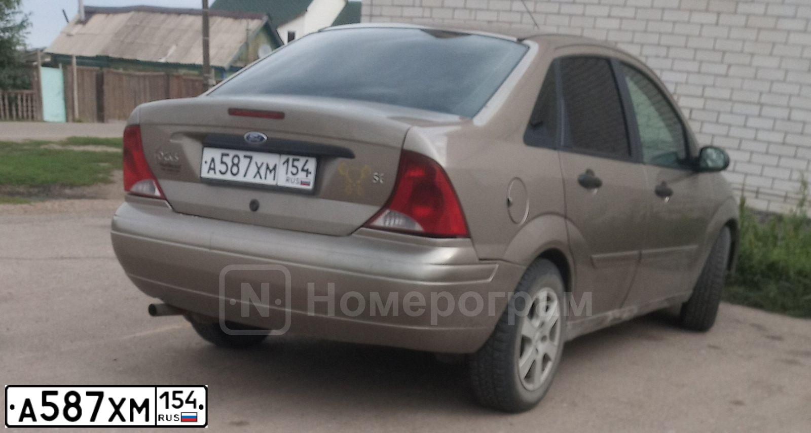 Фото автомобиля FORD FOCUS, 2003 — госномер А587ХМ154. Цвет: СВЕТЛО КОРИЧНЕВЫЙ