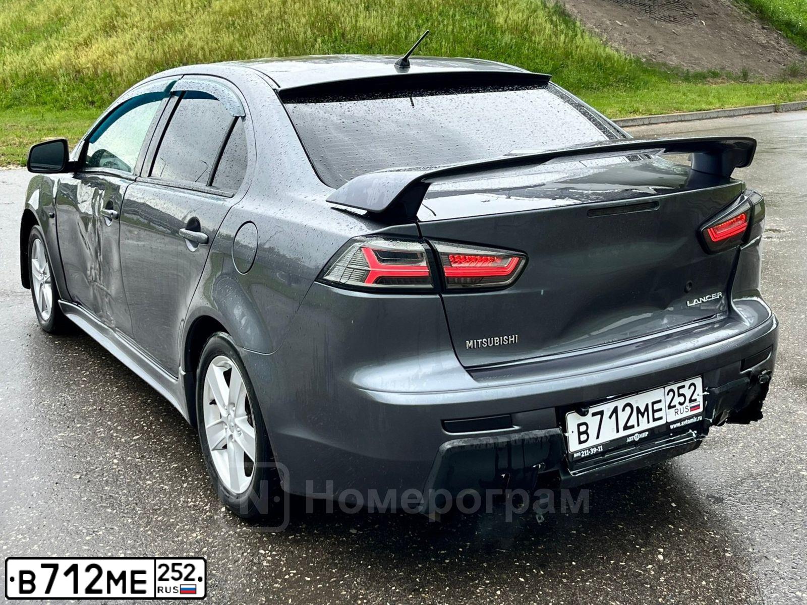 Фото автомобиля MITSUBISHI LANCER, 2008 — госномер В712МЕ252. Цвет: СЕРЫЙ