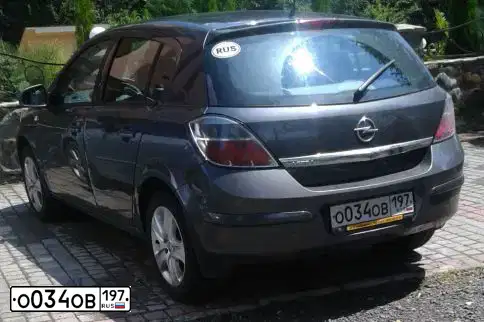 Фото автомобиля OPEL ASTRA, 2011 — госномер О034ОВ197. Цвет: СЕРЫЙ