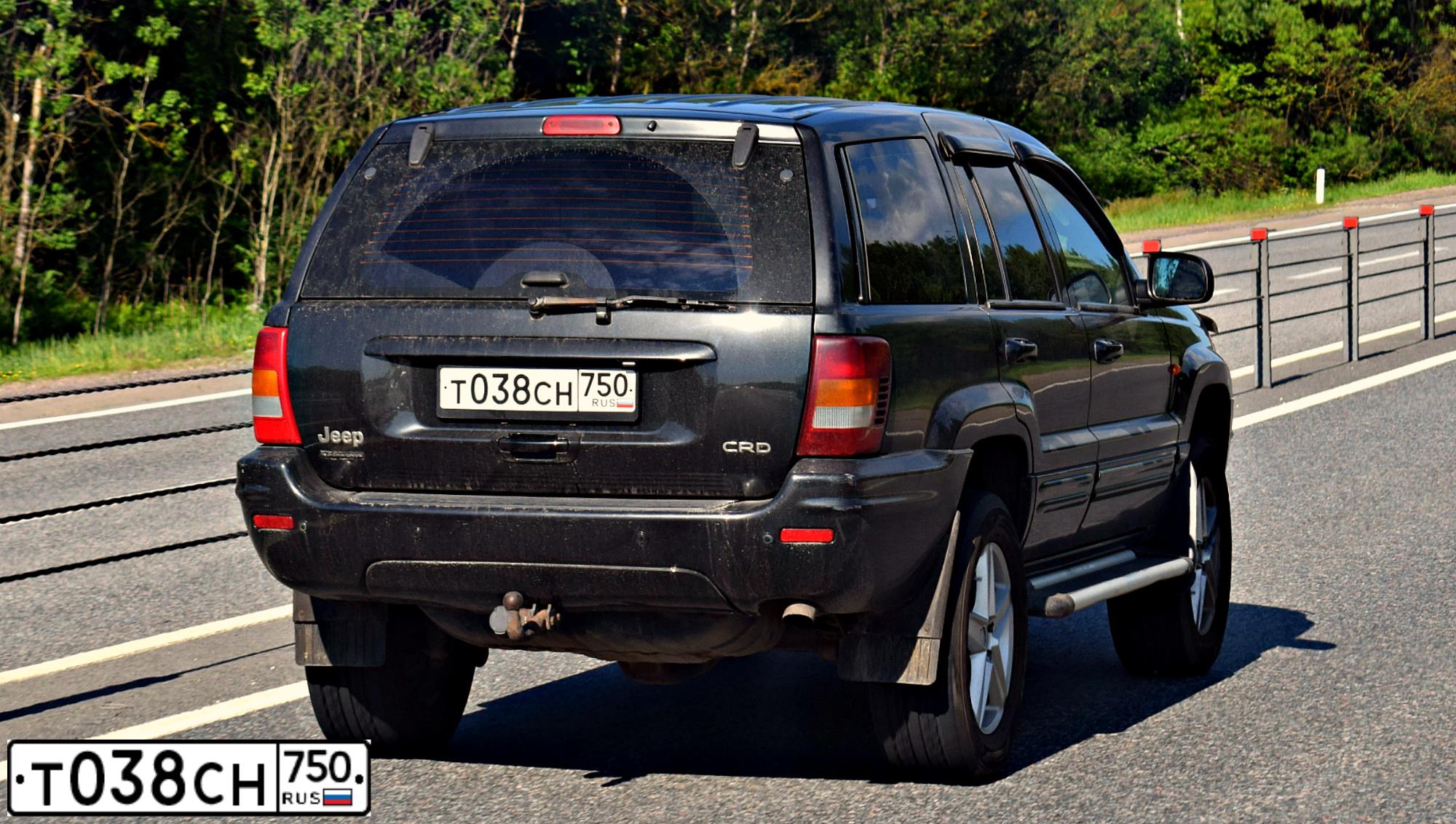 Фото автомобиля JEEP GRAND CHEROKEE, 2004 — госномер Т038СН750. Цвет: ЧЕРНЫЙ