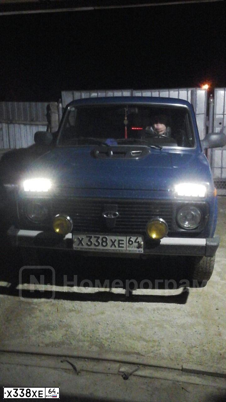 Фото автомобиля LADA 2121 NIVA, 2012 — госномер Х338ХЕ64. Цвет: СИНЕ ЗЕЛЕНЫЙ