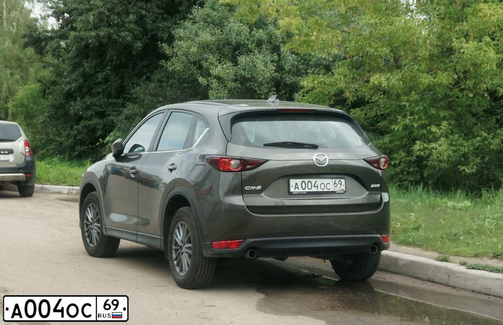 Фото автомобиля MAZDA CX-7, 2011 — госномер К646НС35. Цвет: Белый