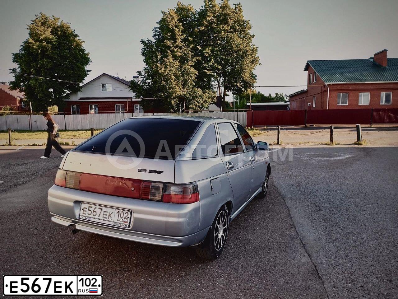 Фото автомобиля LADA 2112, 2007 — госномер Н164АВ702. Цвет: СЕРЕБРИСТО-ГОЛУБОЙ