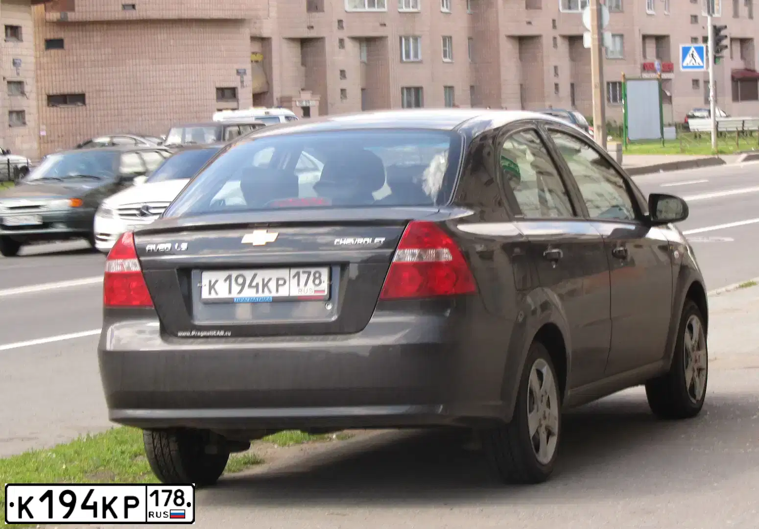 Фото автомобиля CHEVROLET AVEO, 2011 — госномер К194КР178. Цвет: ЧЕРНЫЙ