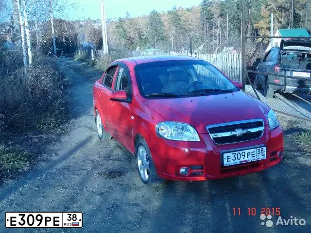 Фото автомобиля CHEVROLET AVEO, 2006 — госномер В906МВ138. Цвет: Красный