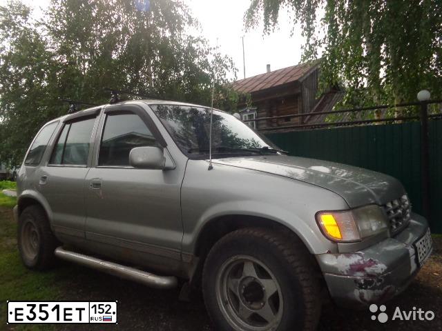 Фото автомобиля KIA SPORTAGE, 1994 — госномер О595РХ97. Цвет: СЕРЫЙ МЕТАЛИК