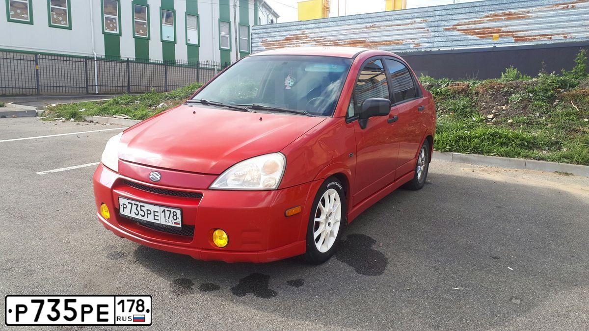 Фото автомобиля SUZUKI AERIO, 2002 — госномер Р753РЕ178. Цвет: Красный