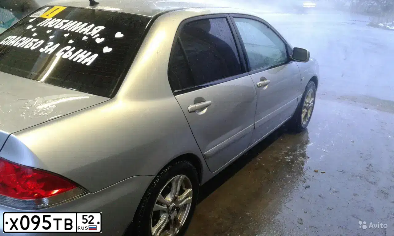Фото автомобиля MITSUBISHI LANCER, 2004 — госномер Х095ТВ52. Цвет: СВЕТЛО-СЕРЫЙ