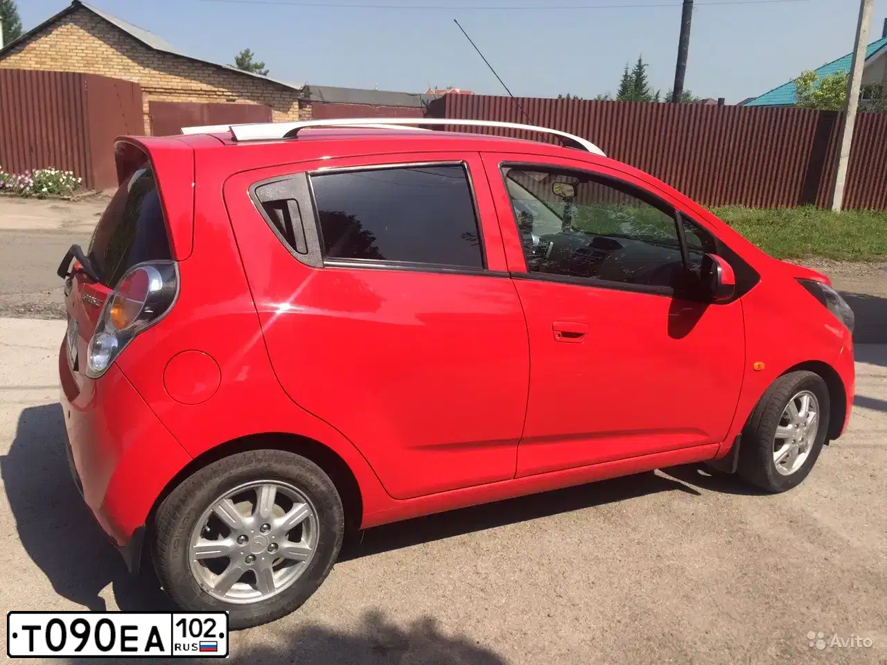 Фото автомобиля CHEVROLET SPARK, 2011 — госномер В244ЕН774. Цвет: Красный