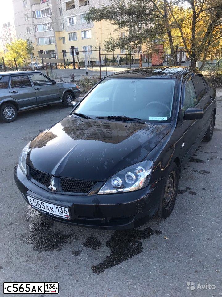 Фото автомобиля MITSUBISHI LANCER, 2006 — госномер Р654АМ48. Цвет: ЧЕРНЫЙ