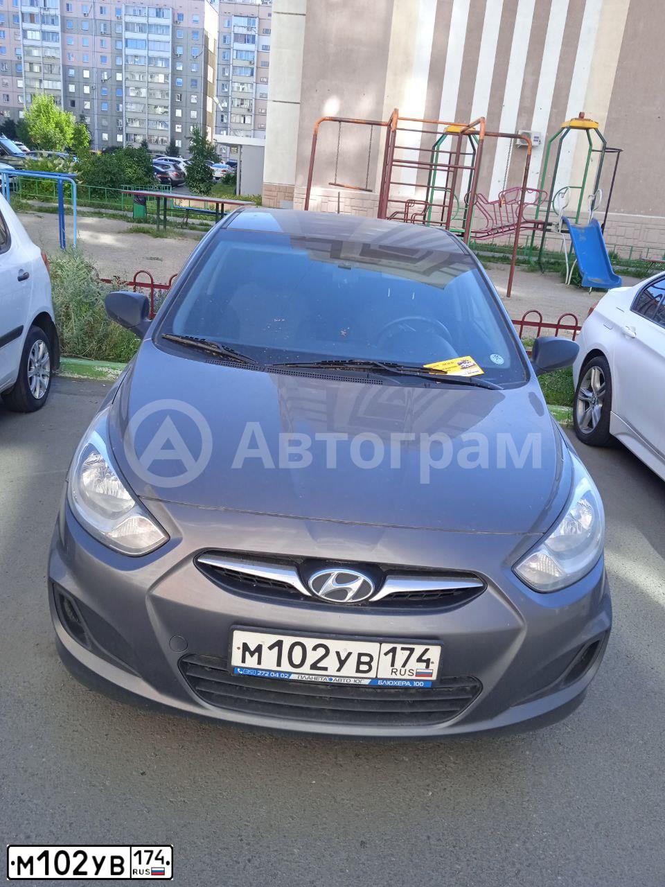 Фото автомобиля HYUNDAI SOLARIS, 2011 — госномер М102УВ174. Цвет: ЧЕРНО-СЕРЫЙ