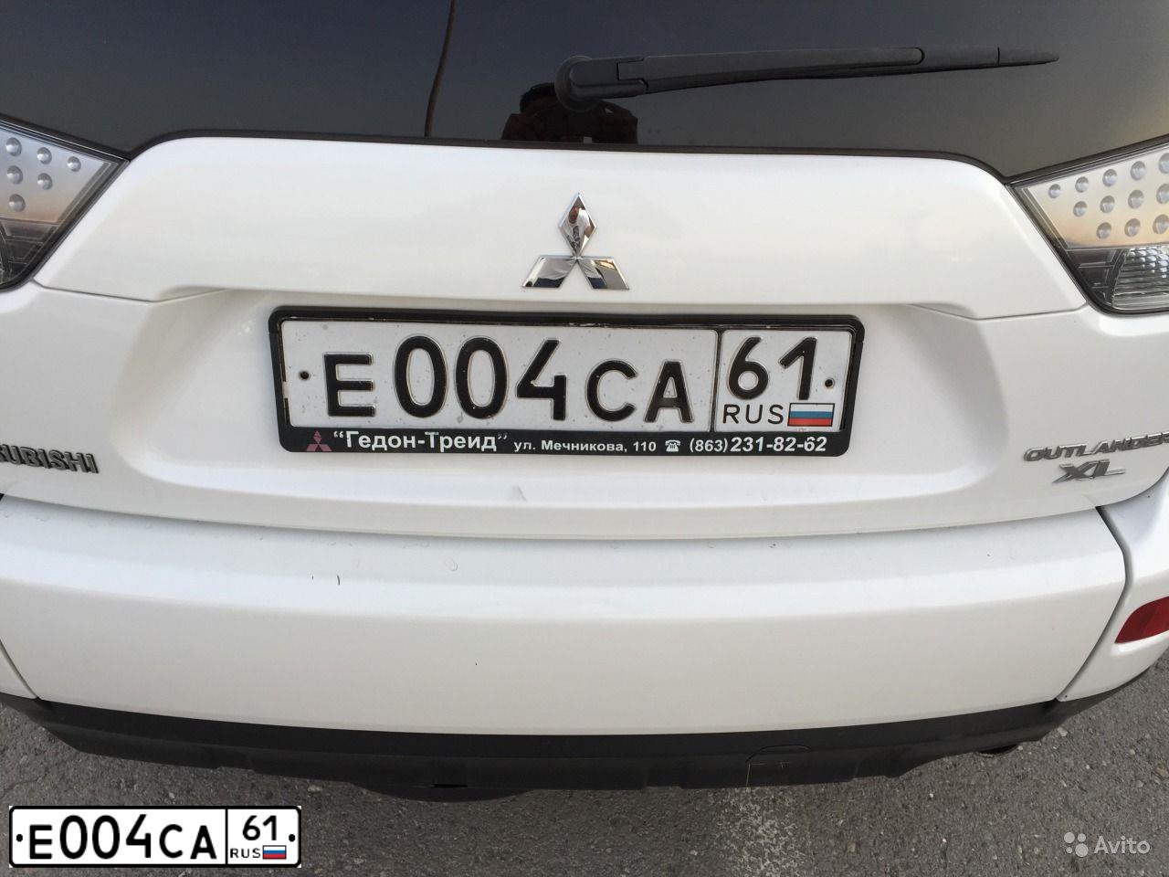 Фото автомобиля MITSUBISHI OUTLANDER, 2007 — госномер Е004СА61. Цвет: БЕЛЫЙ