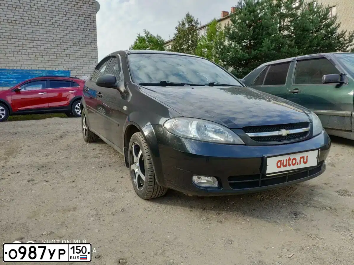 Фото автомобиля CHEVROLET T LACETTI, 2008 — госномер О987УР150. Цвет: ЧЕРНЫЙ