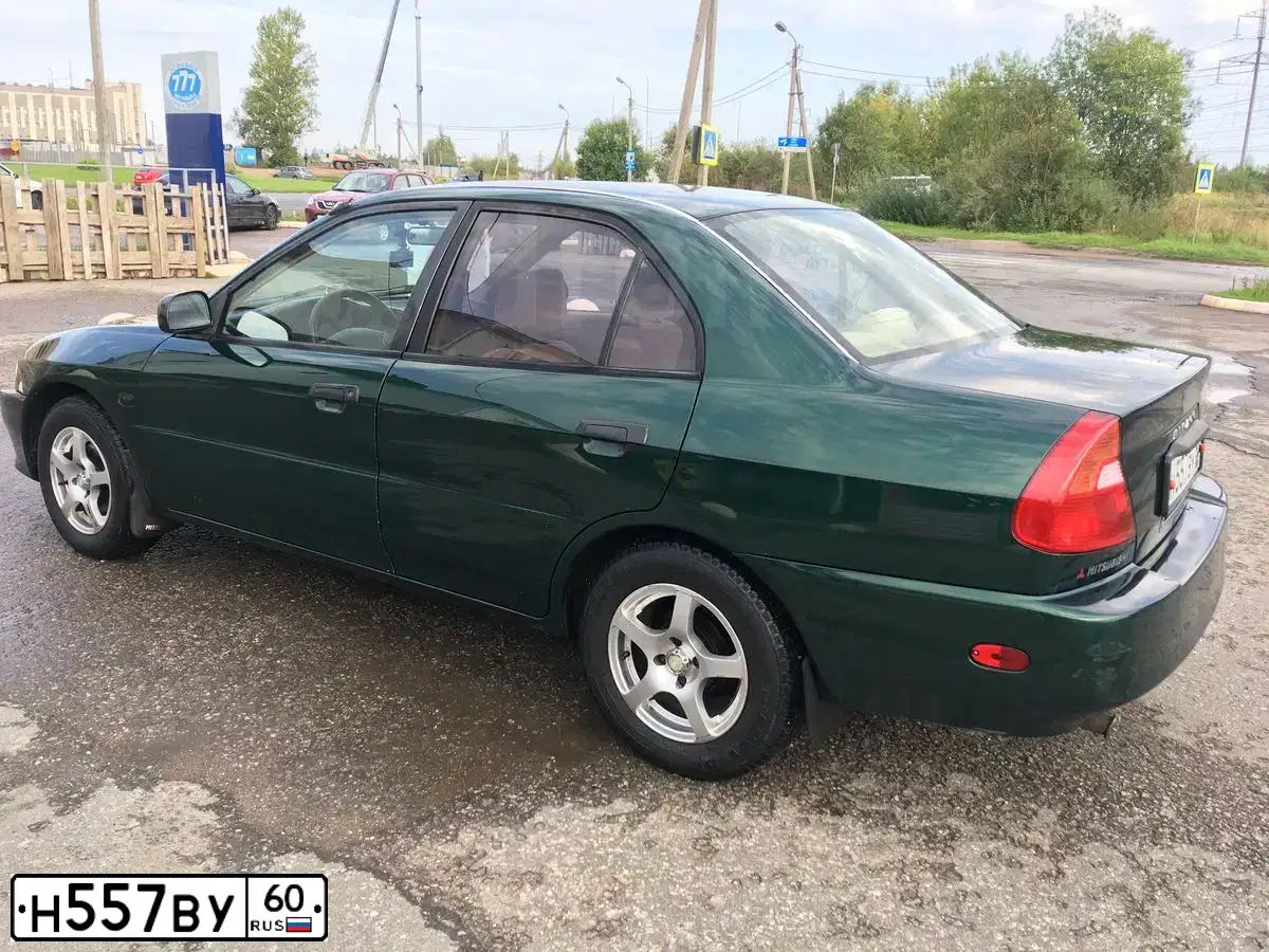 Фото автомобиля MITSUBISHI MIRAGE DINGO, 2001 — госномер А766НВ105. Цвет: ЗЕЛЕНЫЙ