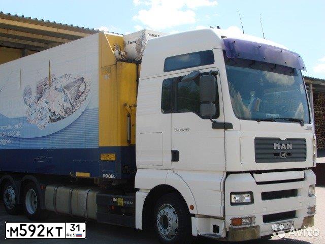 Фото автомобиля MAN TGA 26.XXX /6X2/, 2004 — госномер М592КТ31. Цвет: Белый