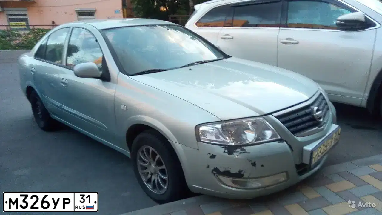 Фото автомобиля NISSAN ALMERA, 2007 — госномер Х985ВВ136. Цвет: Серебристый