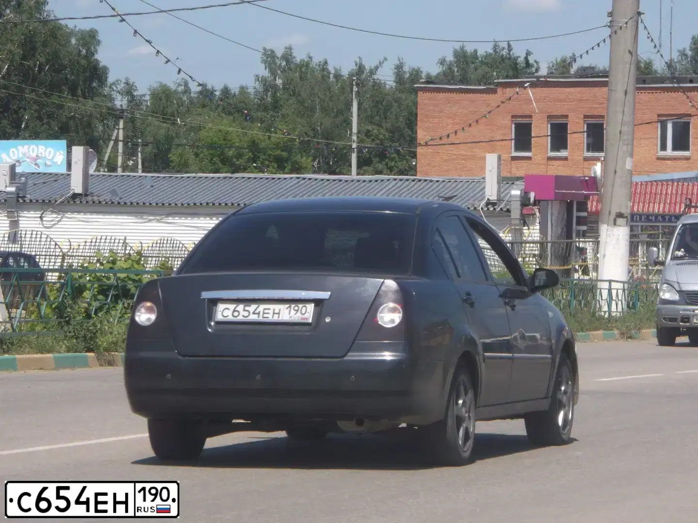 Фото автомобиля TAGAZ VORTEX ESTINA, 2009 — госномер С654ЕН190. Цвет: ЧЕРНЫЙ