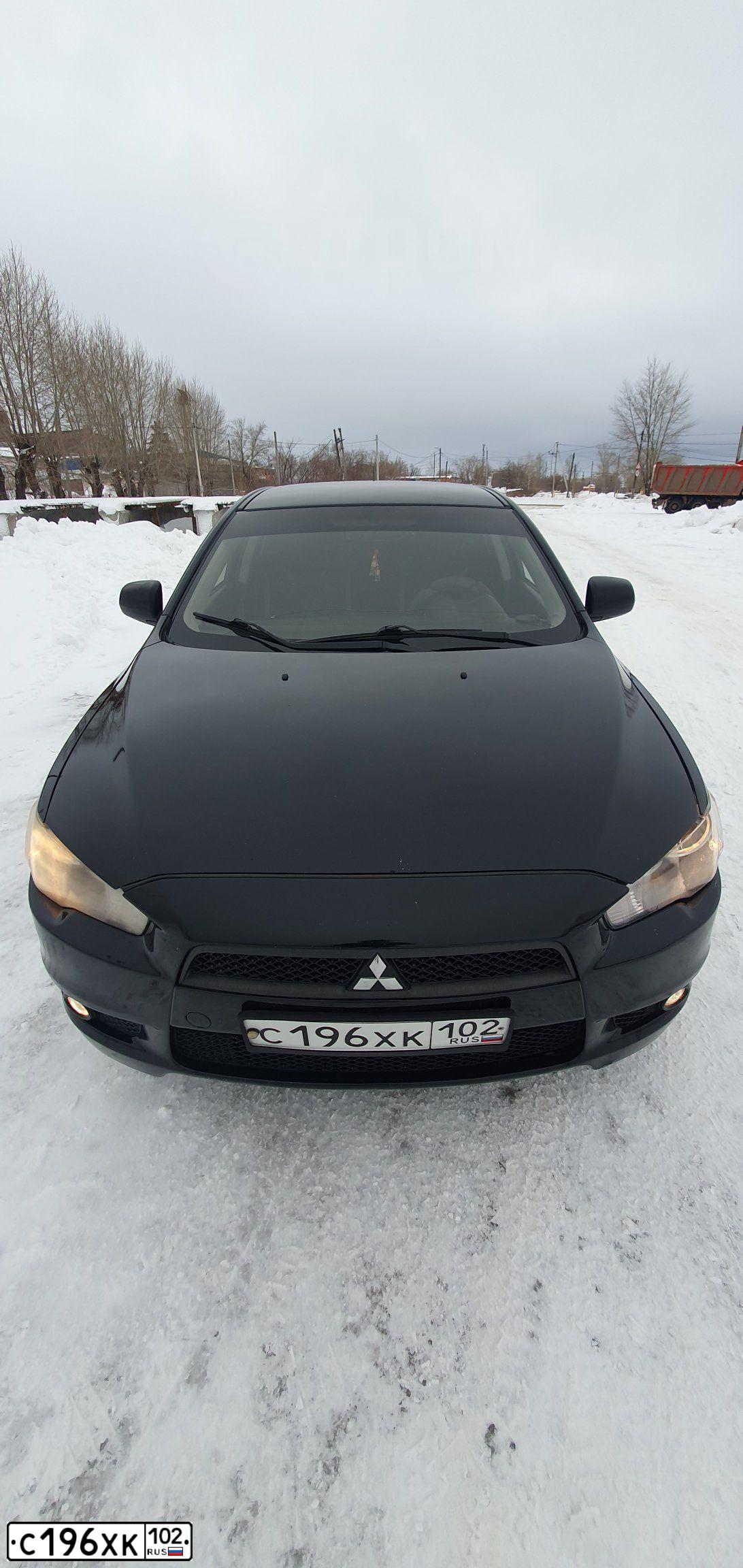 Фото автомобиля MITSUBISHI LANCER, 2010 — госномер Е947КЕ156. Цвет: ЧЕРНЫЙ