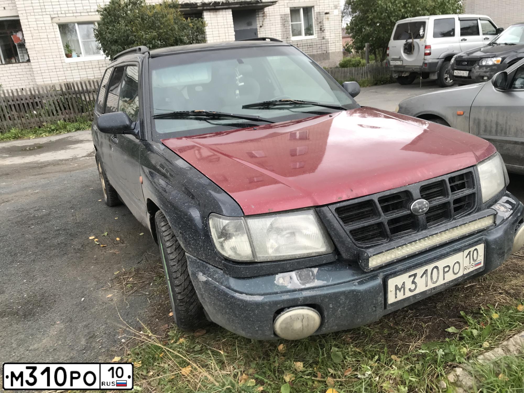Фото автомобиля SUBARU FORESTER, 1997 — госномер М024ХХ82. Цвет: ЧЕРНЫЙ