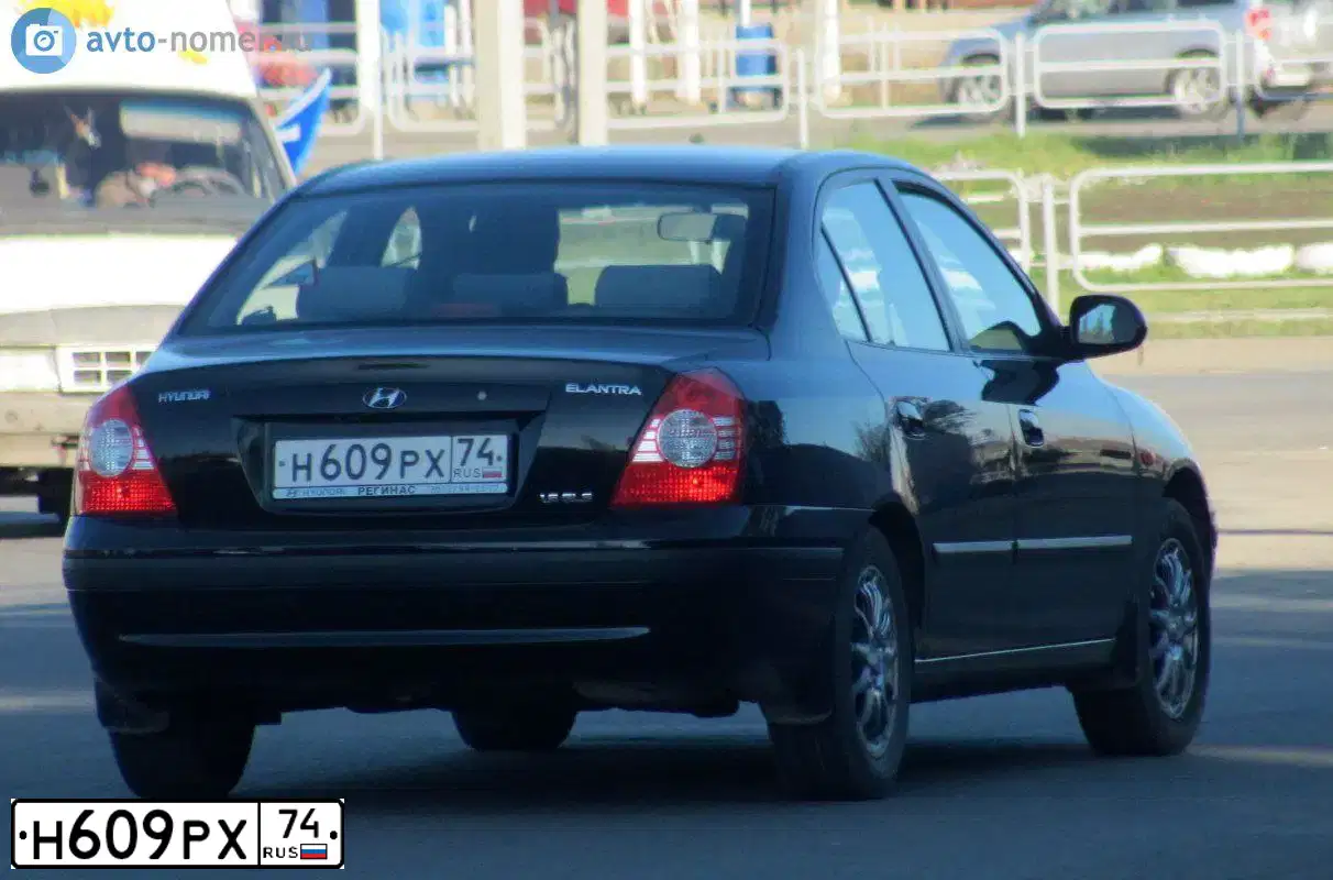 Фото автомобиля HYUNDAI ELANTRA, 2004 — госномер Н609РХ74. Цвет: ЧЕРНЫЙ
